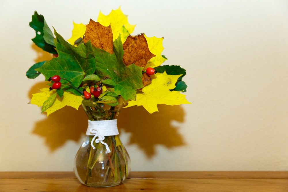 fall leaves in vase hearth decorations