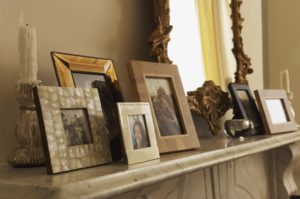 fireplace mantel with family pictures